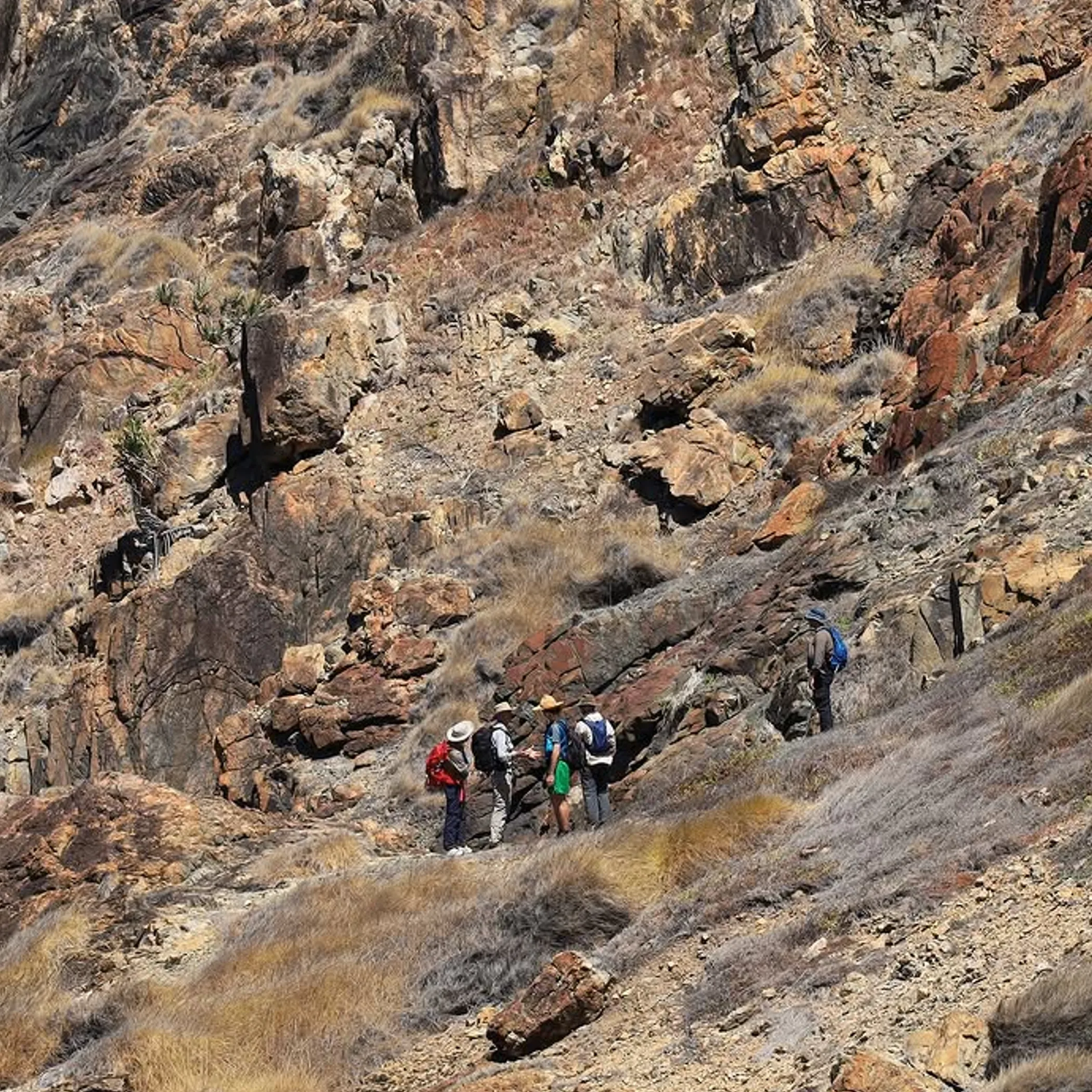 hikers navigating rugged rocky terrain